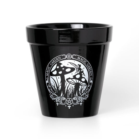 A Vessel of Verdant Arcana – by Alchemy Gothic
Summon nature’s magic with this spellbinding ceramic plant pot by Alchemy Gothic. Featuring their captivating Magic Garden artwork—where fae spirits dance among toadstools and otherworldly flora—this pot is a sacred tool for the witch, the alchemist, or the dark apothecary.

Use it to cradle herbs, gothic blooms, or botanical spells. Whether displayed in your apothecary, sacred altar, or shadowed garden, this vessel will flourish with intention.

Crafted from d