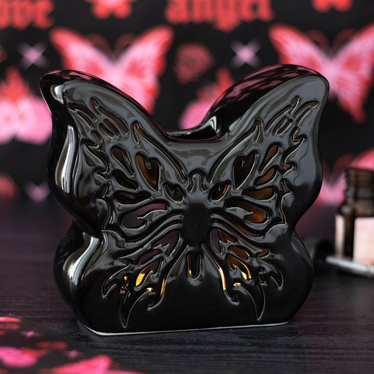 Black Cut-Out Butterfly oil burner with intricate detailing. Use with fragrance oils to create gothic, mystical, and calming home aromas.