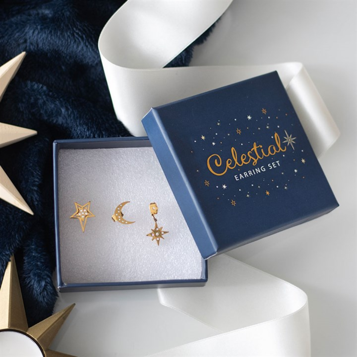 Gold-tone celestial earring set with moon and star designs. Witchy cosmic jewellery perfect for gifting, everyday wear and starlit style.