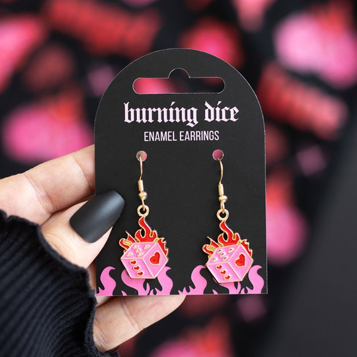 Pink and red burning dice earrings with flame details. Edgy alternative jewellery inspired by luck, risk and rebellious style.