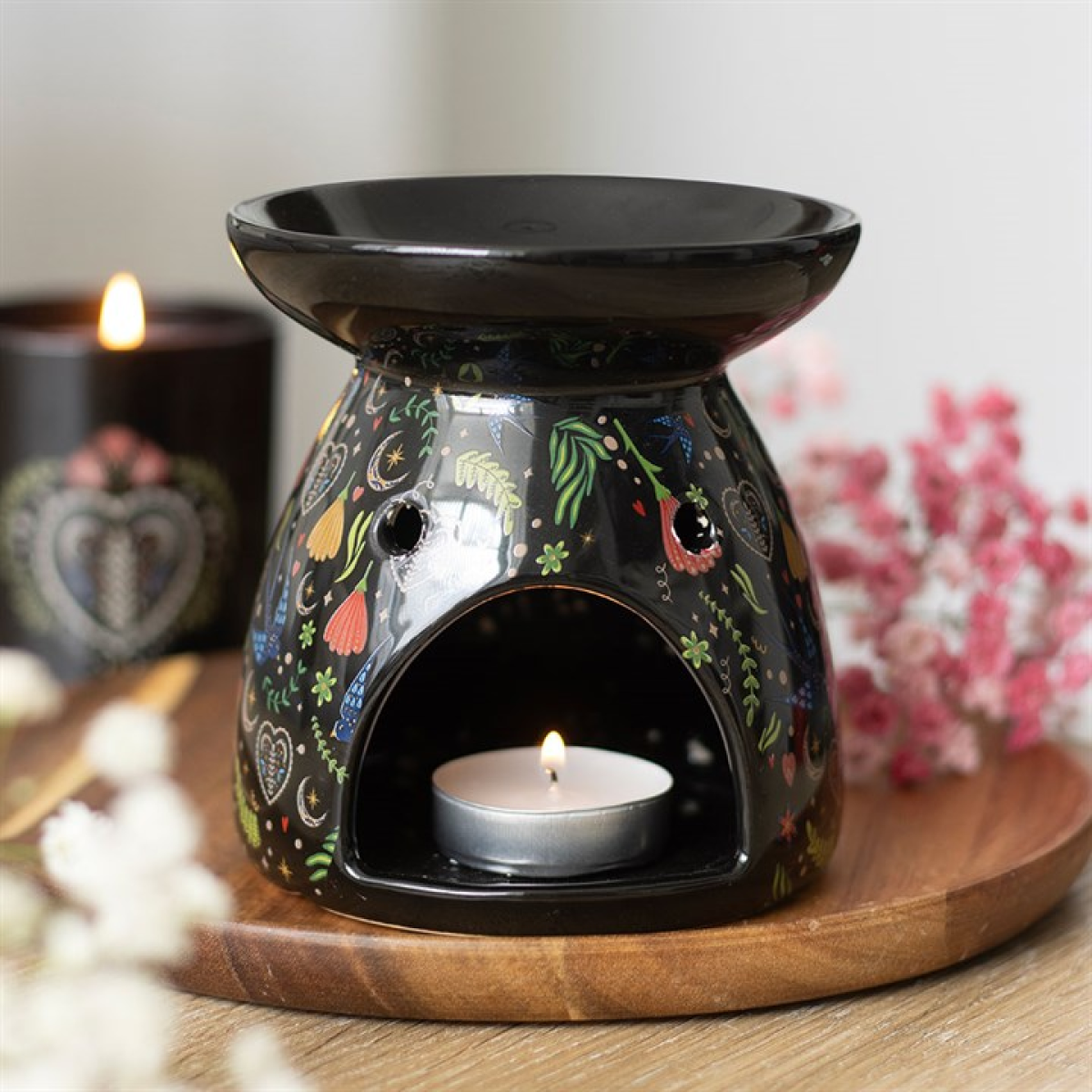 Ceramic Midnight Bloom oil burner with black floral print. Use with fragrance oils or wax melts to create gothic, calming, and aromatic home decor.