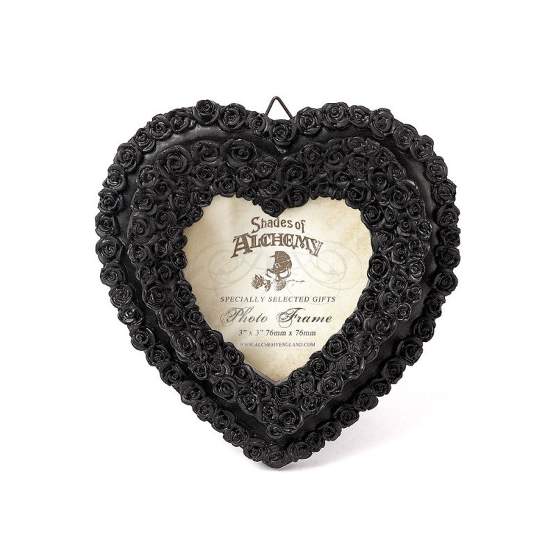 Alchemy Gothic Black Rose Heart Photo Frame – Shades of Alchemy

Embrace the beauty of darkness with this intricately crafted black rose heart photo frame by Alchemy Gothic. Part of the Shades of Alchemy collection, this piece is both elegant and romantic, ideal for capturing the memory of a loved one or adding a gothic flourish to your home décor.

Tiny black roses form a heart shape, creating a stunning border for your cherished photograph. Perfect for gothic boudoirs, altars, or as a meaningful gift for 