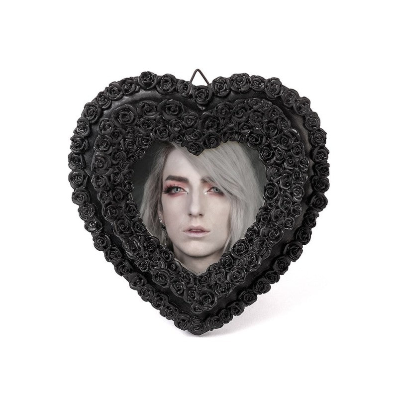 Alchemy Gothic Black Rose Heart Photo Frame – Shades of Alchemy

Embrace the beauty of darkness with this intricately crafted black rose heart photo frame by Alchemy Gothic. Part of the Shades of Alchemy collection, this piece is both elegant and romantic, ideal for capturing the memory of a loved one or adding a gothic flourish to your home décor.

Tiny black roses form a heart shape, creating a stunning border for your cherished photograph. Perfect for gothic boudoirs, altars, or as a meaningful gift for 