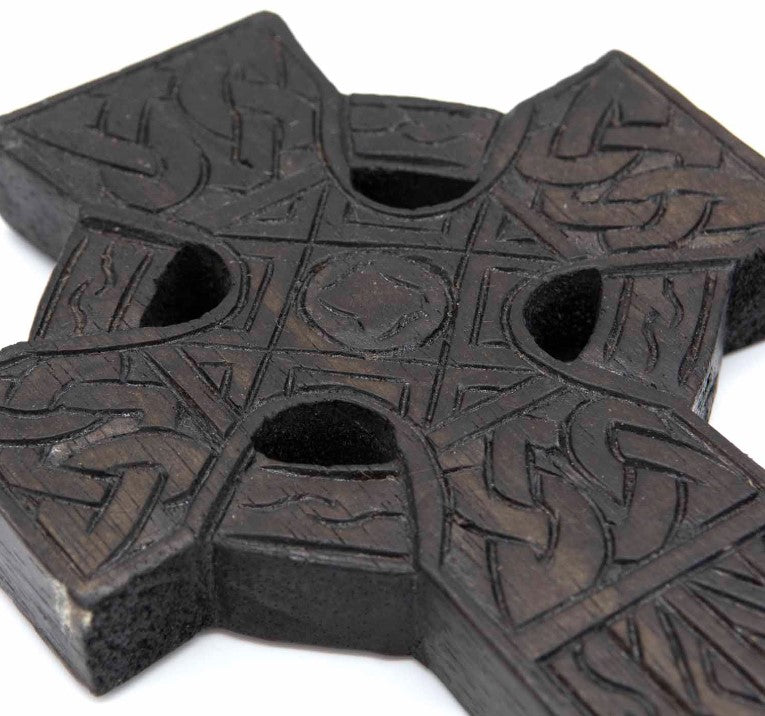 This detailed and lightweight wooden carved Celtic cross is a lovely little piece that has carvings featuring Celtic style knots and etchings.