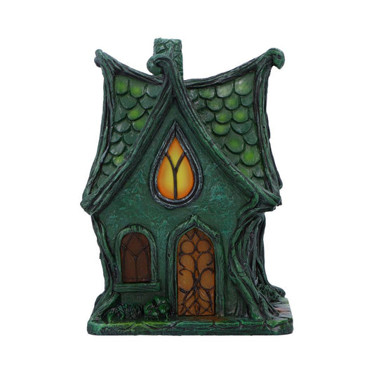 Deep within the shadowed glen lies the Evergreen Lodge — a fairy house aglow with ancient magic. Standing 17cm tall, this gothic-style cottage casts a gentle, mysterious light from within, thanks to its built-in LED illumination that awakens at twilight.

Crafted with care and charm, it features medieval-style arched windows, gnarled tree roots, and delicate s sculpted vines that wind up its stone-like walls. Every crevice whispers of old stories — of hidden folk and moonlit gatherings — making it the perfe