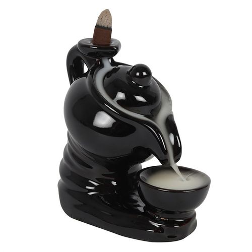 A black ceramic backflow incense burner with an eye-catching teapot and cup design. When a backflow cone is placed on the handle, smoke gently flows from the teapot's spout and collects inside the teacup below. Product Dimensions: H14cm x W13.5cm x D8.5cm Packaged Dimensions: H15.5cm x W16cm x D10cm