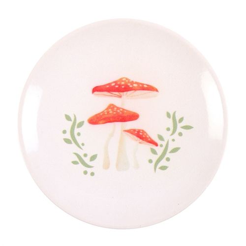 This charming trinket dish showcases an enchanting drawing of three red-spotted mushrooms. Ideal for cradling your jewelry, keys, or little keepsakes gathered from woodland adventures, it adds a magical touch to any cottage or whimsical bedside setting.