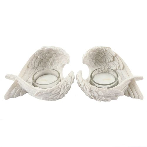 This enchanting duo of white resin angel wing tealight holders brings a touch of celestial magic to any space. Perfect displayed solo or together on a mantle or tabletop, they add a subtle, mystical glow to your home. A charming treasure for your sacred space or a thoughtful gift for kindred spirits.