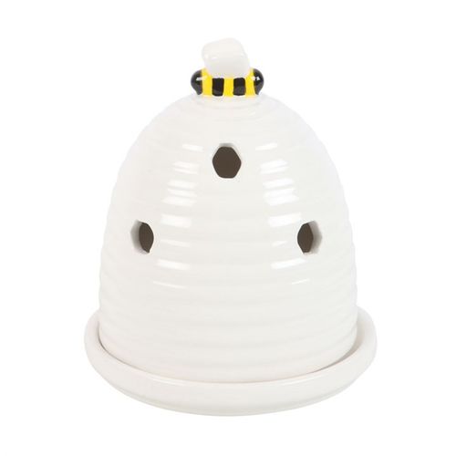 Experience the enchanting aroma with this ceramic incense cone holder, crafted to resemble a delicate white beehive. Crowned by a charming little bee, it brings a touch of magic to your altar, nightstand, or sacred space as it gently fills the air with fragrant whispers.