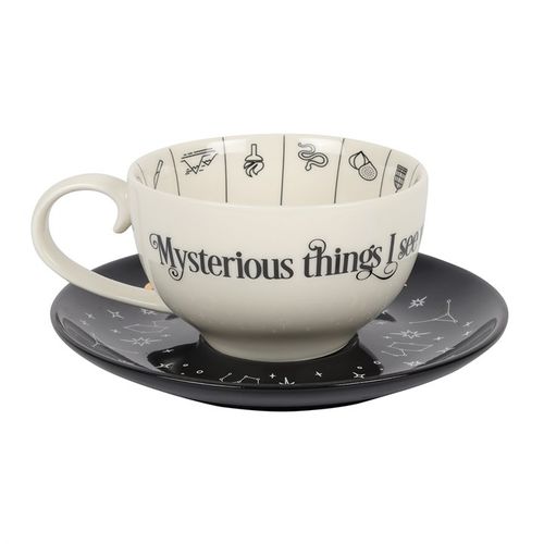 This enchanting ceramic teacup is crafted for the art of tea leaf reading, adorned with an array of mystical fortune telling and astrological symbols highlighted in shimmering gold foil. It rests on a striking black saucer and bears the cryptic inscription, "Mysterious things I see when telling fortunes in tea." A magical treasure to cherish. Dimensions: H7.5cm x W18.5cm x D18cm. Packaged size: H21.5cm x W21.5cm x D14.5cm.