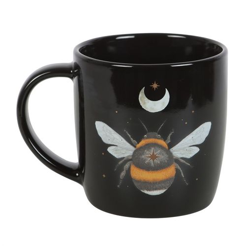 Start your day with a hint of magic using this dark forest bee ceramic mug. Crafted from black ceramic, it showcases an enchanting bee motif surrounded by a crescent moon and twinkling stars. With a 340ml capacity, this mug is both microwave and dishwasher safe, perfect for your mystical morning rituals.
