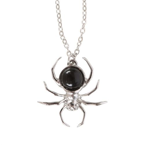Spider-shaped necklace with a black center on a white background