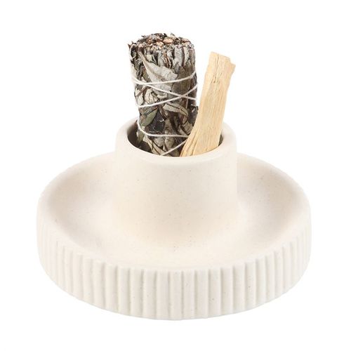 This cream ribbed ceramic smudge bowl is perfect for holding sage or incense. Its ribbed texture adds a contemporary yet timeless touch to any space. Providing a sense of calm and balance, this smudge bowl can be used to enhance spiritual rituals or used as a decorative accent.