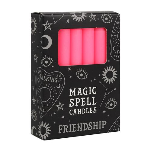 Pack of pink candles labeled 'Magic Spell Candles Friendship' with black packaging featuring celestial designs.