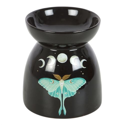 Infuse your sacred space with the magickal energy of transformation and lunar guidance. This captivating black oil burner features the elegant luna moth — a symbol of spiritual rebirth — framed by silvery moon phases to invoke intuition, reflection, and divine femininity.

Place your favorite essential oil or wax melt in the dish above and allow its gentle aroma to awaken your senses and elevate your home's vibration. Whether used during meditation, ritual, or daily relaxation, this enchanting piece is more