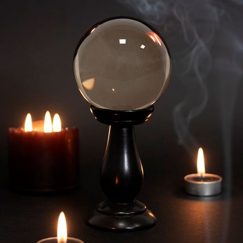 This small, smoky grey crystal ball is not only a powerful tool in fortune telling and scrying, but also makes an eye-catching piece of decor. Whether used for divination or a table accessory at Halloween, this crystal ball is sure to be a conversation piece.