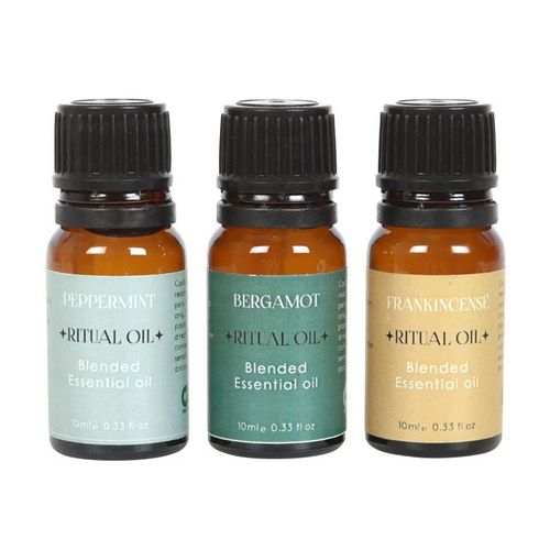 Three essential oil bottles labeled 'Peppermint', 'Bergamot', and 'Frankincense' on a white background.