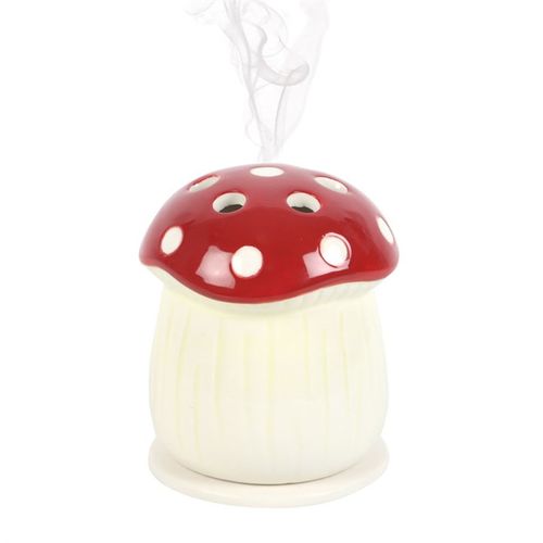 Add a touch of magic to any dull day with this ceramic incense cone holder, crafted in the enchanting form of a red mushroom. Radiating joyful energy, this whimsical piece will grace your altar, side table, or nightstand, filling your space with captivating scents and mystical charm.